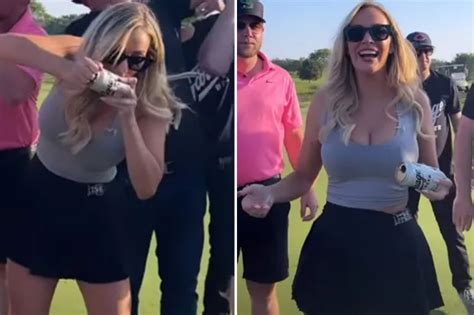 Paige Spiranac Puts On Very Busty Display In Low Cut Grey Top As She Slams A Beer On The Golf