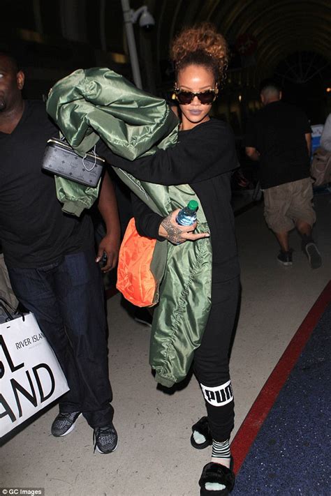 Rihanna Shows Off Her Laid Back Style In Tracksuit And Sliders At Lax