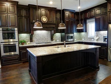 The deep rich hues of the wood work really bring. Wood flooring in kitchen, dark cabinets.. I wasn't sure ...