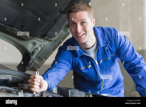 Male Mechanic Working On Automobile Engine Stock Photo Alamy