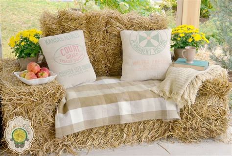 A Couch Made Out Of Hay With Pillows On It