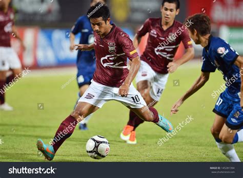 Football leagues from all over the world. Bangkok,Thailand-June 26:Thana Chanaboot (#10) Of Police ...