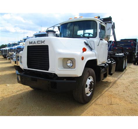 1998 Mack Dm690s Ta Roll Off Jm Wood Auction Company Inc