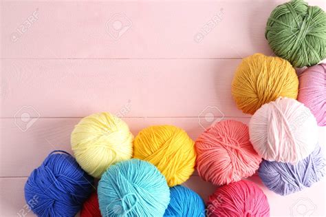 Free Download Balls Of Knitting Yarn On Color Background Stock Photo