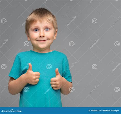 Portrait Of Happy Smiling Boy In Blue T Shirt Attractive Kid In Studio