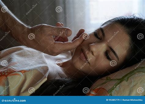 A Man`s Hand Caresses The Girl`s Face In The Morning The Girl Is Smiling Stock Image Image Of