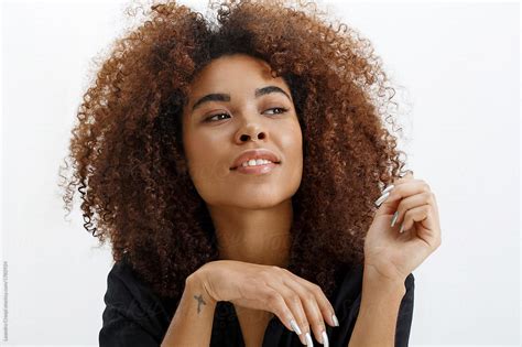 Natural Woman Curly Hair In Studio Del Colaborador De Stocksy