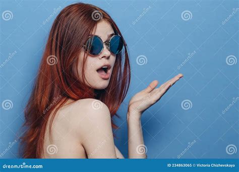 perky red haired woman in blue glasses bare shoulders posing stock image image of people