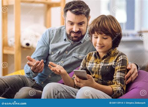 Happy Son And Daddy Having Conversation Stock Photo Image Of Home