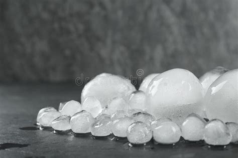 Many Melting Ice Balls On Dark Table Space For Text Stock Image