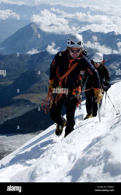 Climbers Approaching The Top Of The Weissmies Switzerland Stock Photo