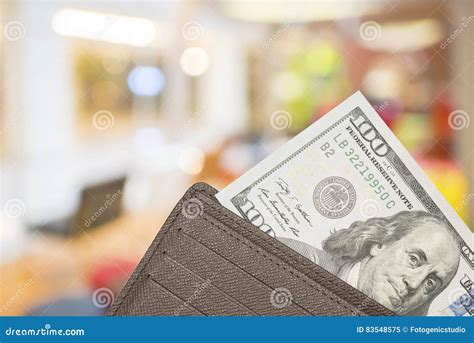 Leather Wallet With 100 Dollar Bills Over Colorful Background Stock