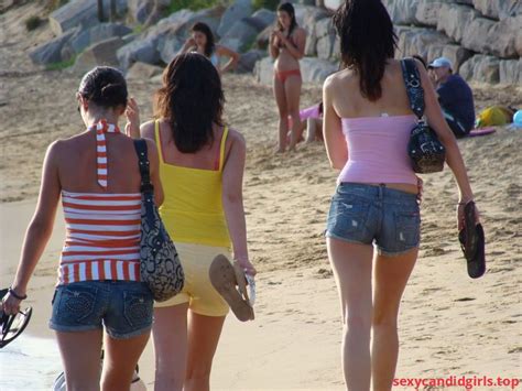 sexycandidgirls top a group of awesome hot candid girls in mini shorts at the beach item 1