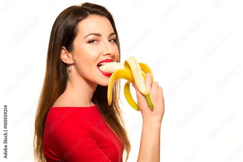 Sexy Woman In Red Clothes Eating Banana On White Background Isol Photos