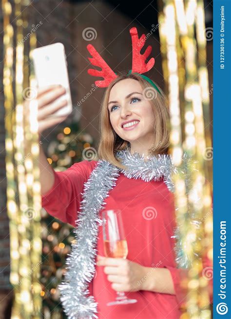 Young Happy Woman Drinking Champagne And Taking Selfie At New Year`s
