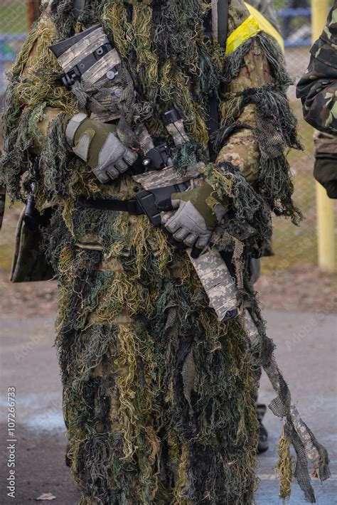 Sniper Riflesniper Rifle In Hands Of Sniper In Camouflage Ghillie Suit