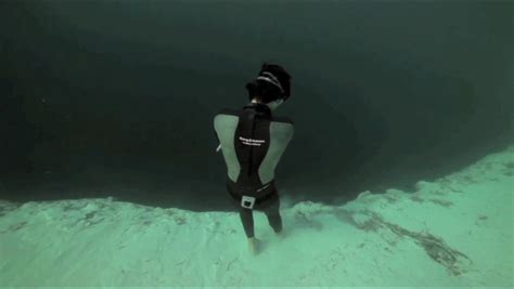 Diver Stands At The Edge Of An Underwater Sinkhole That Drops Down Vertically R Thalassophobia