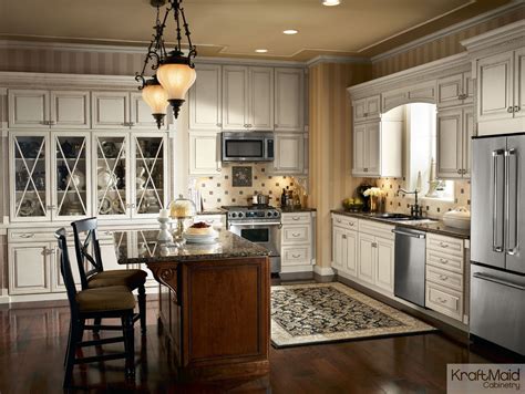 Kraftmaid kitchen cabinets gallery sale, installation of closing doors color name. A classic white KraftMaid kitchen featuring a warm island ...