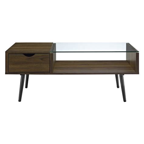 The coffee table has been constructed out of solid wood and wood veneers and finished in a classic black hue that blends effortlessly with any contemporary décor scheme. Manor Park Wood and Glass Coffee Table | Coffee table ...