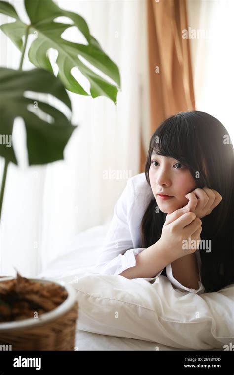 Portrait Beautiful Asian Girl Sleeping On Bed In White Room Stock Photo