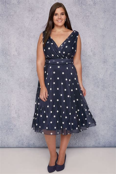Get a truly classic look in this polka dot dress. SCARLETT & JO Navy & White Polka Dot Wrap Over Midi Dress ...