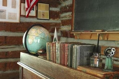 A Teachers Desk And A Chalkboard In An Old Fashioned One Room