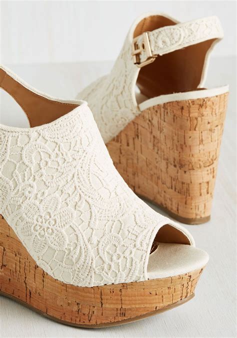 Both Alluring And Elegant These White Wedges By Report Footwear Bring
