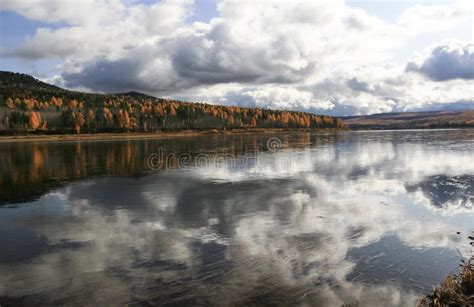 Autumn Landscape On The Taiga Siberian River With The Reflection Of The