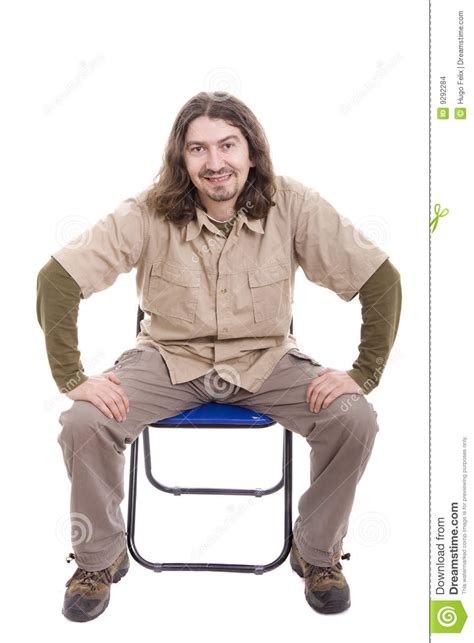 Young Man Sitting On A Chair Stock Photo Image Of
