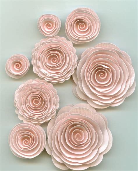 Pink Paper Flowers Arranged On A Light Blue Background