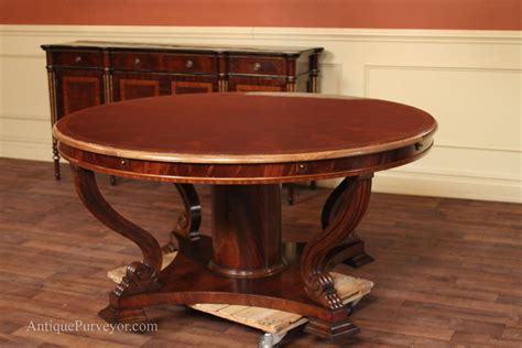 Topped off in our brown cherry finish, this large round farm table pretty much guarantees your home will be the destination for many thanksgivings to come! Extra Large 88 Round Mahogany Dining Table with Perimeter Leaves