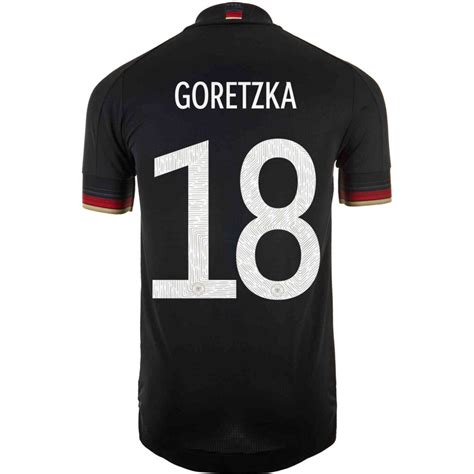 Germany arrives on the condivo jersey template with a blackout effect, featuring monochromatic logo and federation crest. 2021 adidas Leon Goretzka Germany Away Authentic Jersey - SoccerPro