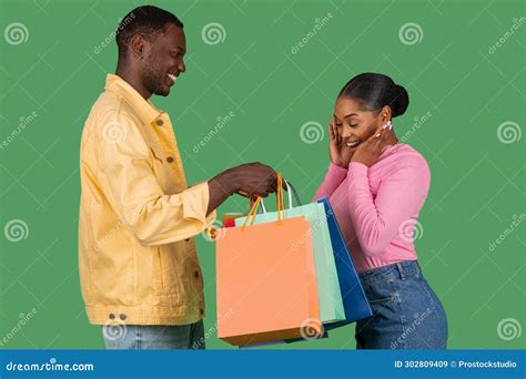 Loving African American Guy Surprising His Girlfriend With Purchases Stock Image Image Of