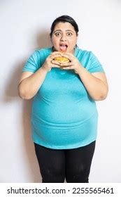 Overweight Fat Indian Woman Eating Burger Stock Photo 2255565461