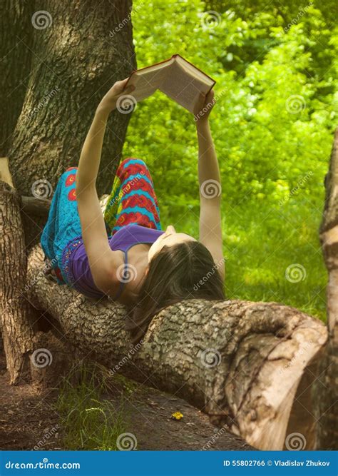Girl Reading A Book Outdoors Stock Photo Image Of Brunette