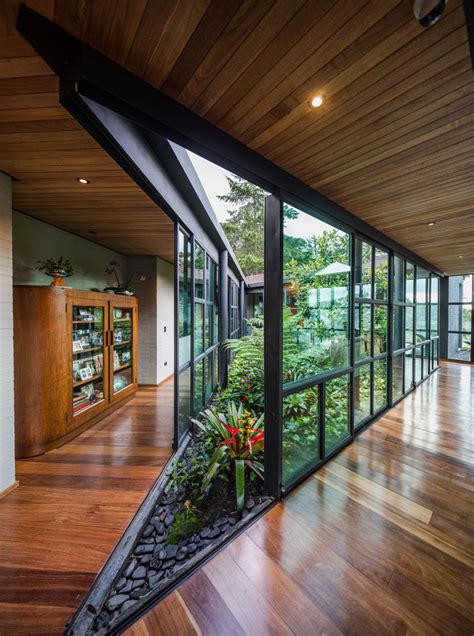 This Triangular Shaped House Makes Room For An Interior Garden In 2022