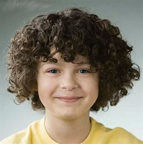 In this haircut for boys, the curly hair is trimmed rather short and uniform that ensures both texture and volume. 10 Cool & Smart Curly Haircuts for Little Boys - Cool Men ...