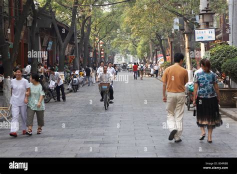 People Walking Down Main Street In Muslim District Xian China Stock
