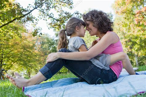 Mother And Daughter Relaxing On Blanket Stock Image F0052644 Science Photo Library