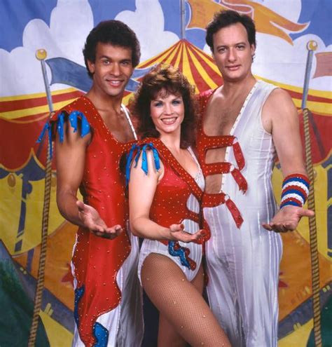 Two Men And A Woman Dressed In Costume Posing For A Photo With Circus