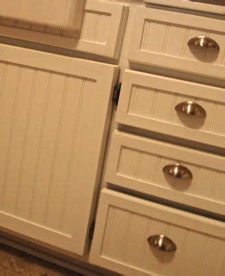 Much like crown molding makes walls look more classy, crown molding does the same for cabinets. Kitchen cabinet rehab with beadboard + trim pieces + paint ...
