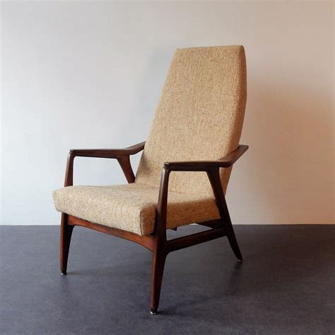 The chair and ottoman each feature one reclining position. Vintage teak lounge chair, 1960s | #115141