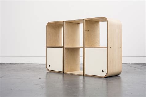Arrangement of Modular storage system by Lozi, made from curved birch