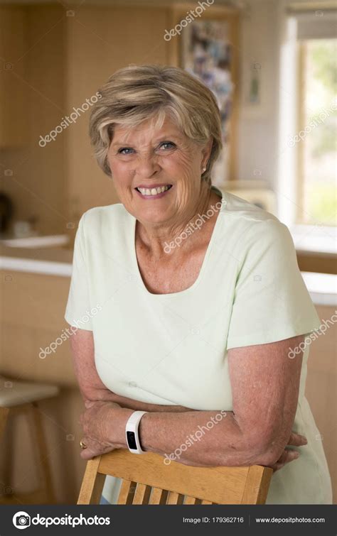 Beautiful Portrait Of Pretty And Sweet Senior Mature Woman In Middle Age Around 70 Years Old