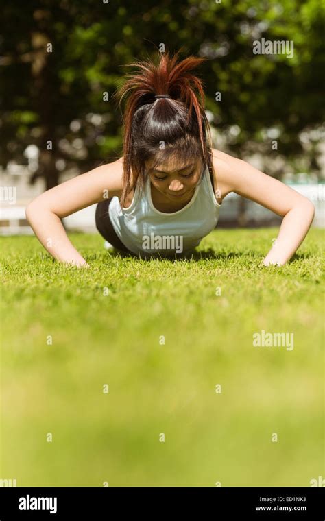 Healthy Woman Doing Push Ups In Park Stock Photo Alamy