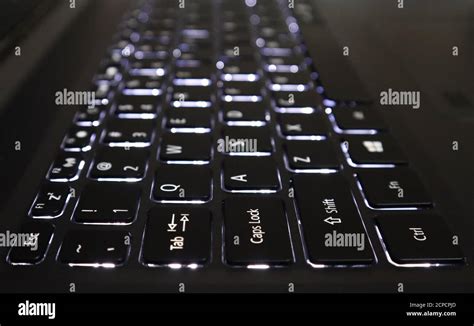 White Backlit Keyboard Of A Laptop With Selective Focus And Blur