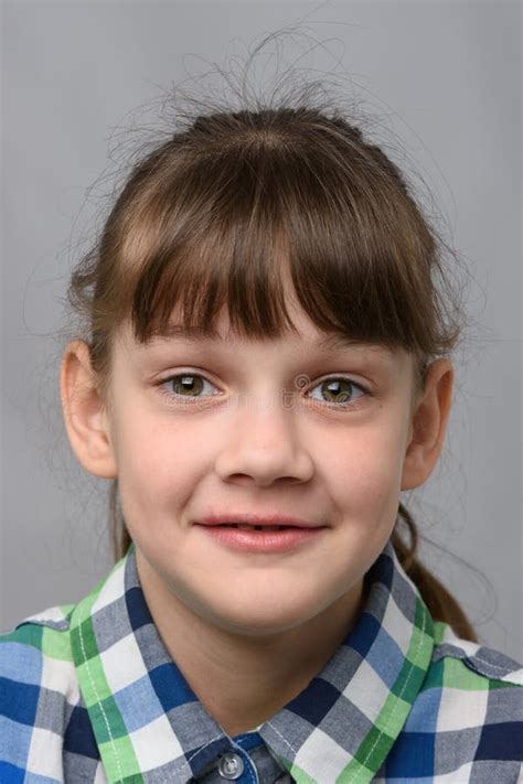 Portrait Of A Joyfully Smiling Ten Year Old Girl Of European Appearance