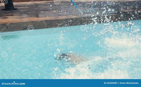 muscular guys in swimming trunks run up and stock footage video of splash person 56200980