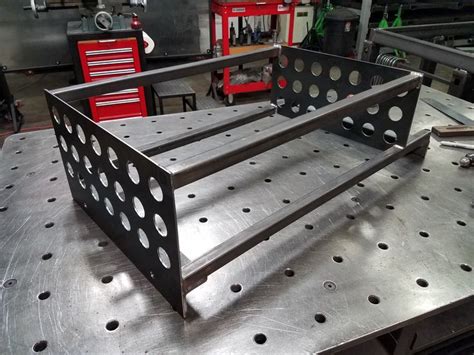 A Metal Work Bench With Holes In It