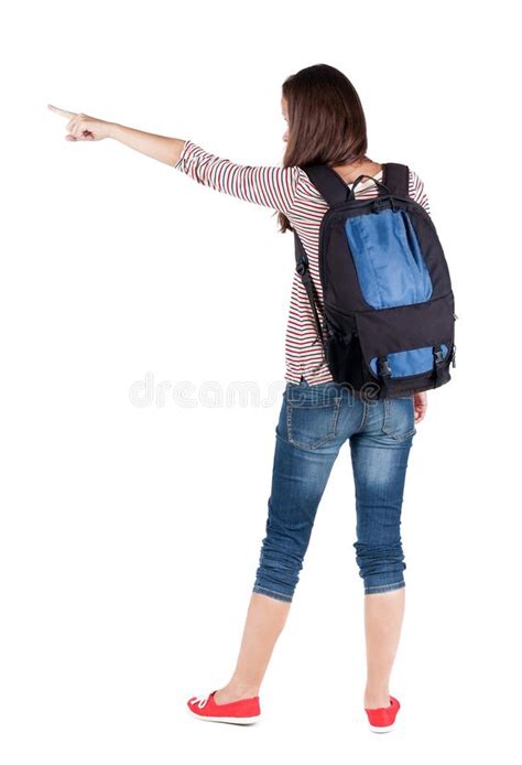 Back View Of Pointing Woman With Backpack Looking Up Stock Photo